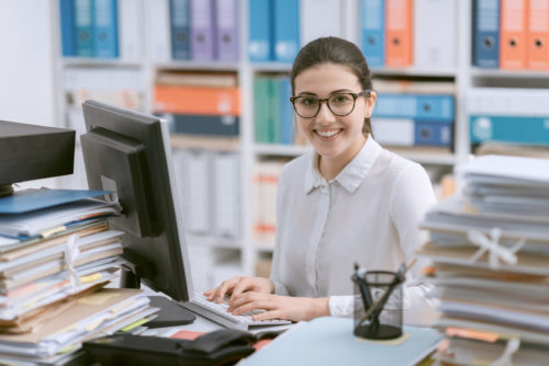 young-secretary-working-and-smiling