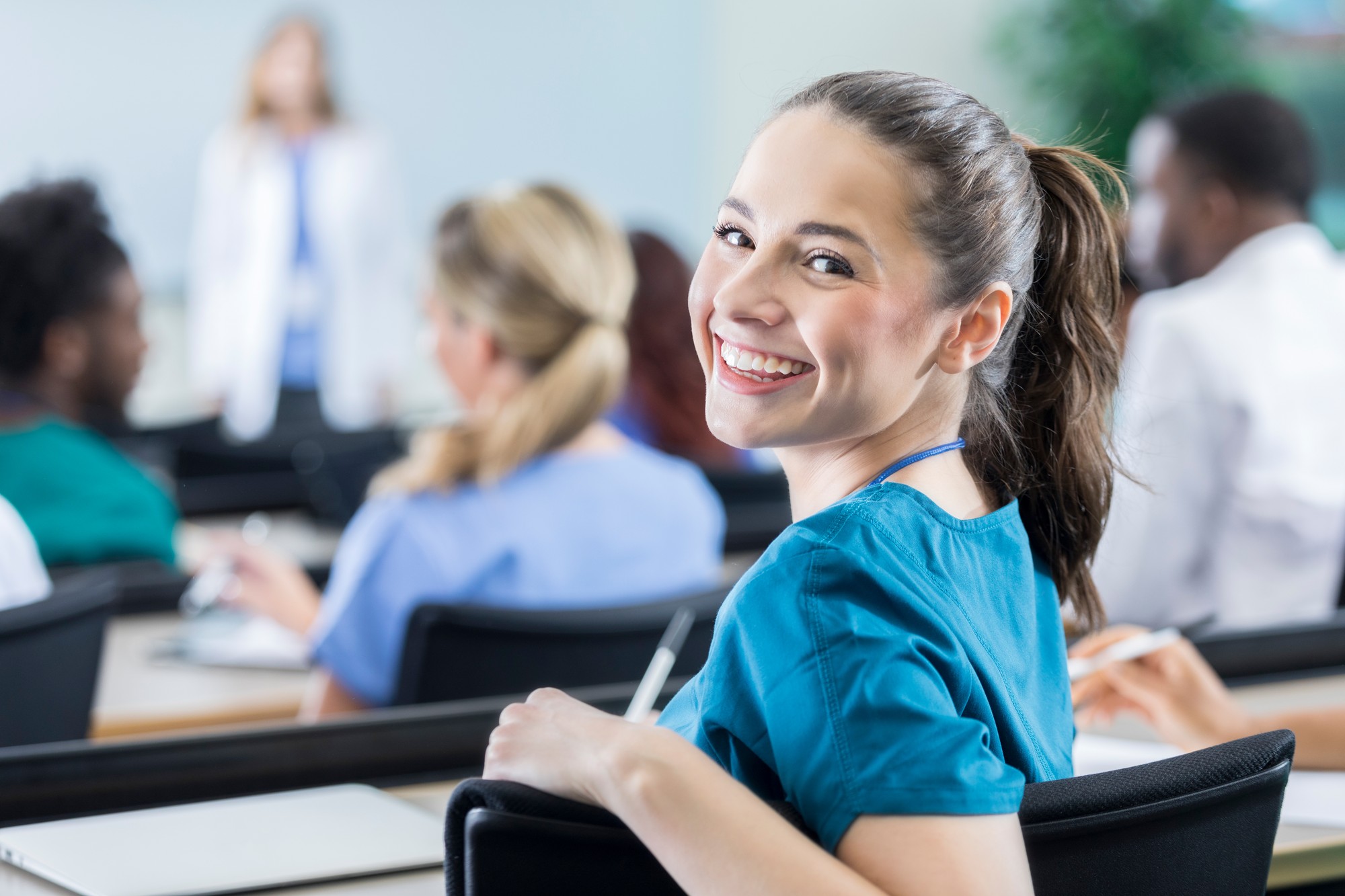 Cheerful female medical student in the classroom