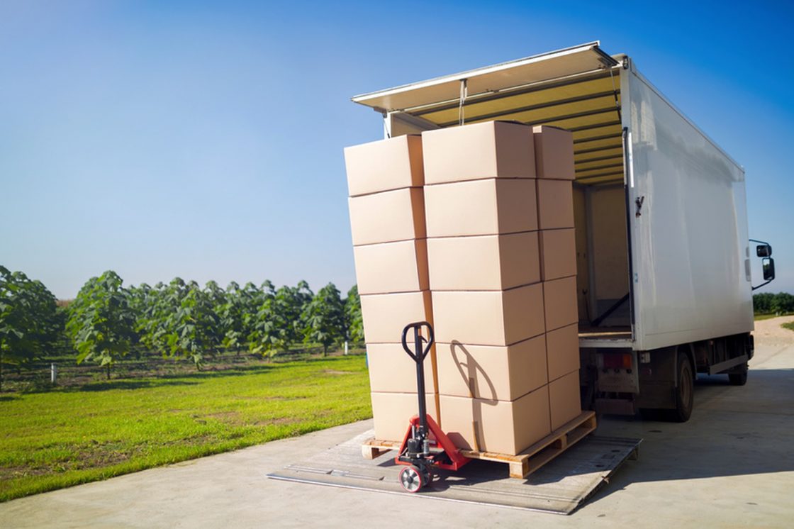Truck transporting goods packed in boxes from warehouse