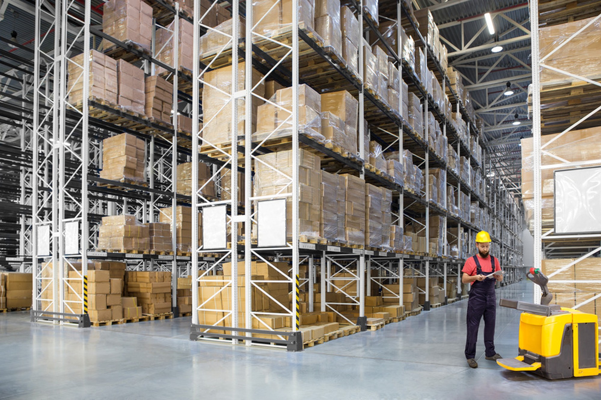 A worker in a huge distribution warehouse