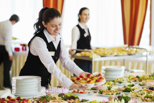 restaurant-waitress-serving-table-with-food