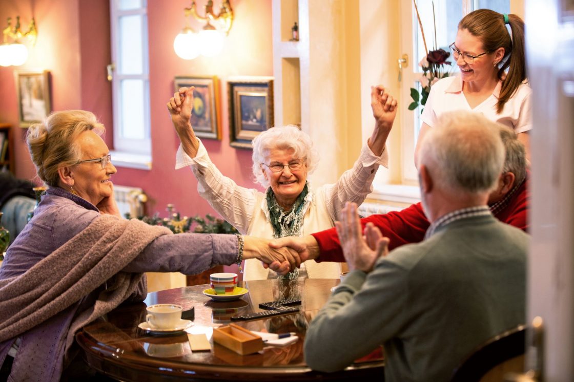 retirement-home-occupants-sitting-at-the-table-together
