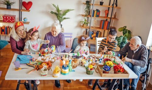 Multi-Generation Family preparing Easter decoration together at home