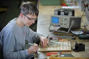 a man working on a circuit board