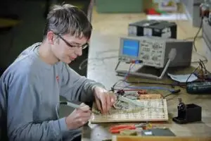 a man working on a circuit board