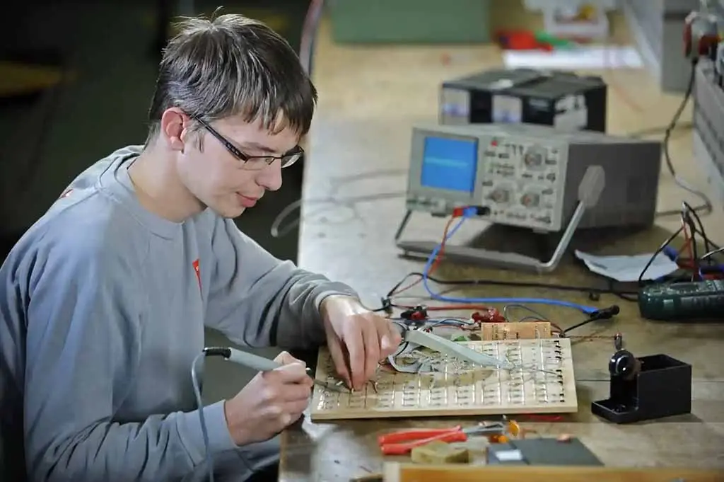 a man working on a circuit board